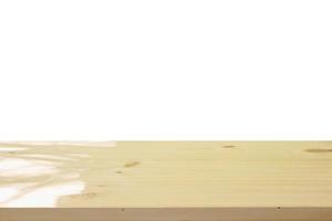 Empty wooden table top isolated on white background for montage product display photo