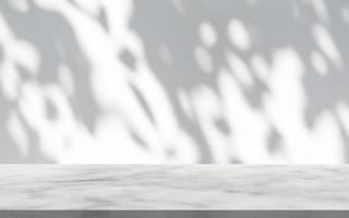 Marble table with tree shadow drop on white wall background for mockup product display photo