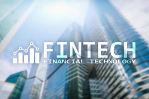 FINTECH - Financial technology, global business and information Internet communication technology. Skyscrapers background. Hi-tech business concept. photo