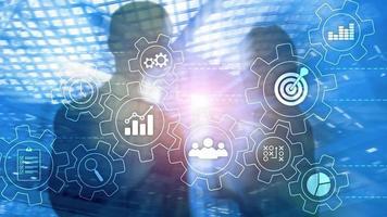 Business process automation concept. Gears and icons on abstract background photo