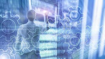 Double exposure gears mechanism on blurred background. Business and industrial process automation concept. photo