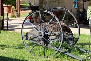 Old agricultural machinery stands on the street in Israel and rusts photo