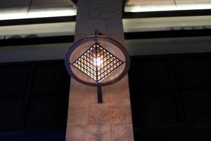 Lantern to illuminate the city street at night. photo