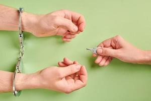 Release of prisoner. Hands in handcuffs photo