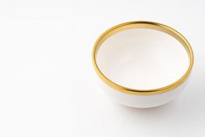 A white and brown ceramic bowl on a white background photo
