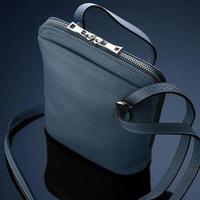 A closeup shot of a luxury blue leather bag photo