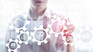 Automation technology and smart industry concept on blurred abstract background. Gears and icons. photo