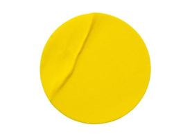 Yellow round paper sticker label isolated on white background photo