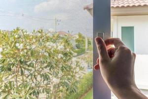 Hand hold mosquito net wire screen handle on house window photo