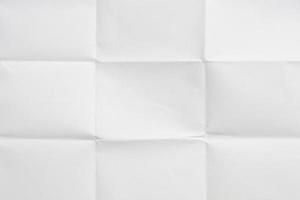 White folded and wrinkled paper texture background photo