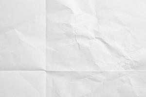 White folded and wrinkled paper texture background photo