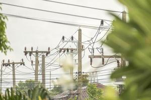 Electric power poles with power lines background photo