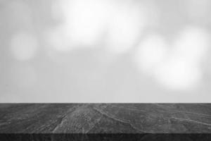 Marble table top with tree shadow drop on white wall background for mockup product display photo