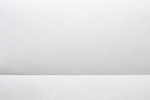 White folded and wrinkled paper texture background photo