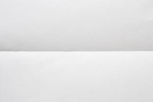 White folded and wrinkled paper texture background photo