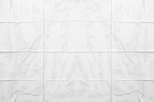 white crumpled and creased paper poster texture background photo