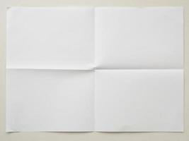 White folded and wrinkled paper on white background photo