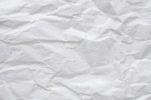 white crumpled and creased recycle paper texture background photo