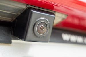 Red car rear view camera close up for parking assistance photo