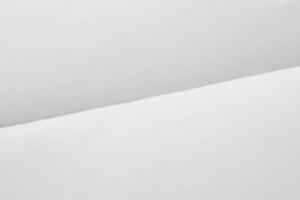 White folded and wrinkled paper texture background photo