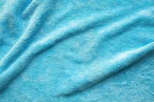 Blue towel fabric texture surface close up background photo