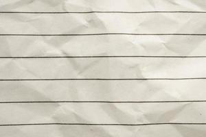 Blank crumpled lined notebook paper texture background photo