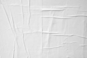 white crumpled and creased paper poster texture background photo