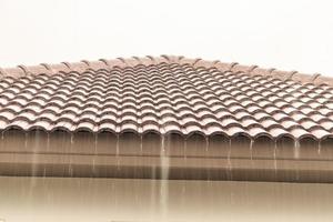 rain falling down from the house roof photo