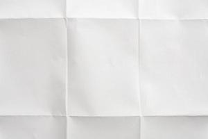 White folded and wrinkled paper texture background photo