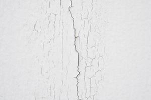 cracked concrete on white wall texture background photo