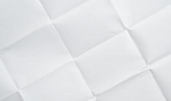 White folded and wrinkled paper texture background photo
