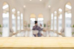 Empty wood table top with cafe restaurant interior blurred background photo