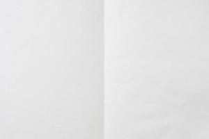 White folded and wrinkled paper texture background photo