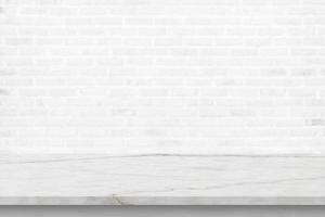 Empty white marble table top with brick wall background photo