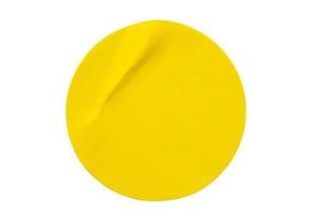 Yellow round paper sticker label isolated on white background photo