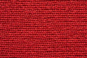 Red knitted cloth wool texture surface background photo