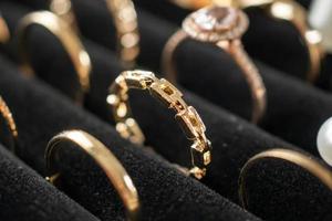 Gold jewelry diamond rings show in luxury retail store display showcase photo