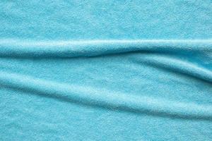 Blue towel fabric texture surface close up background photo