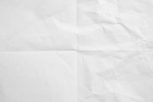 White folded and wrinkled paper texture background photo