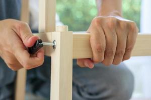 Assembly wooden furniture at home using screw allen photo