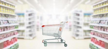 empty red shopping cart in supermarket photo