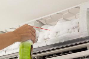 air conditioner cleaning with spray foam cleaner photo