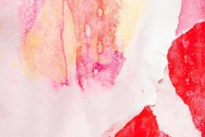 Abstract red watercolor paint on torn paper background texture photo