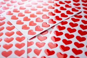 Close up red heart sticker on white paper photo