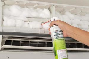 air conditioner cleaning with spray foam cleaner photo