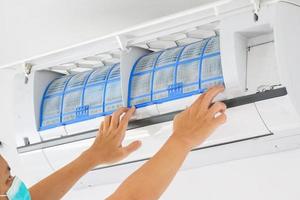 man hand hold air conditioner filter cleaning concept photo