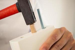 Man assembling furniture at home photo