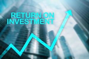 ROI - Return on investment. Stock trading and financial growth concept on blurred business center background. photo