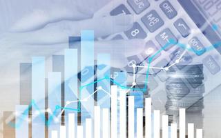 Graph on rows of coins for banking, finance on digital stock market financial exchange and trading graph. photo