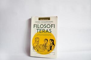 Blitar, Indonesia - October 9, 2022 A book entitled Filosofi Teras by Levina Lesmana which contains the philosophy of life. Book with white cover and elegant animation isolated on white background photo